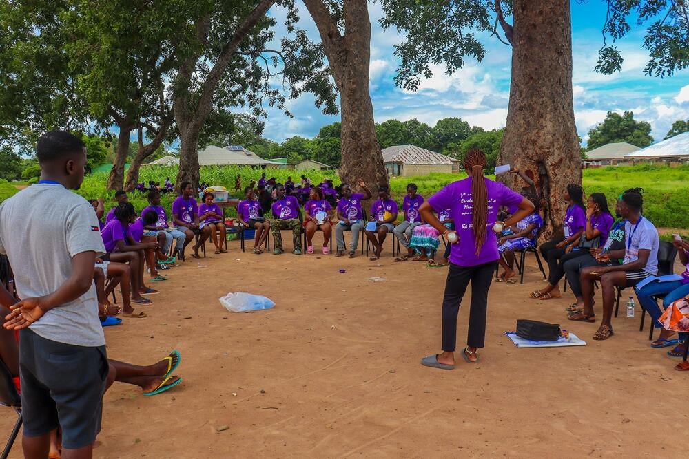 Discussing gender-based violence at summer camp.