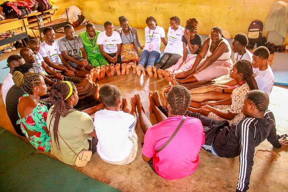 Youth coming together for a group exercise session.